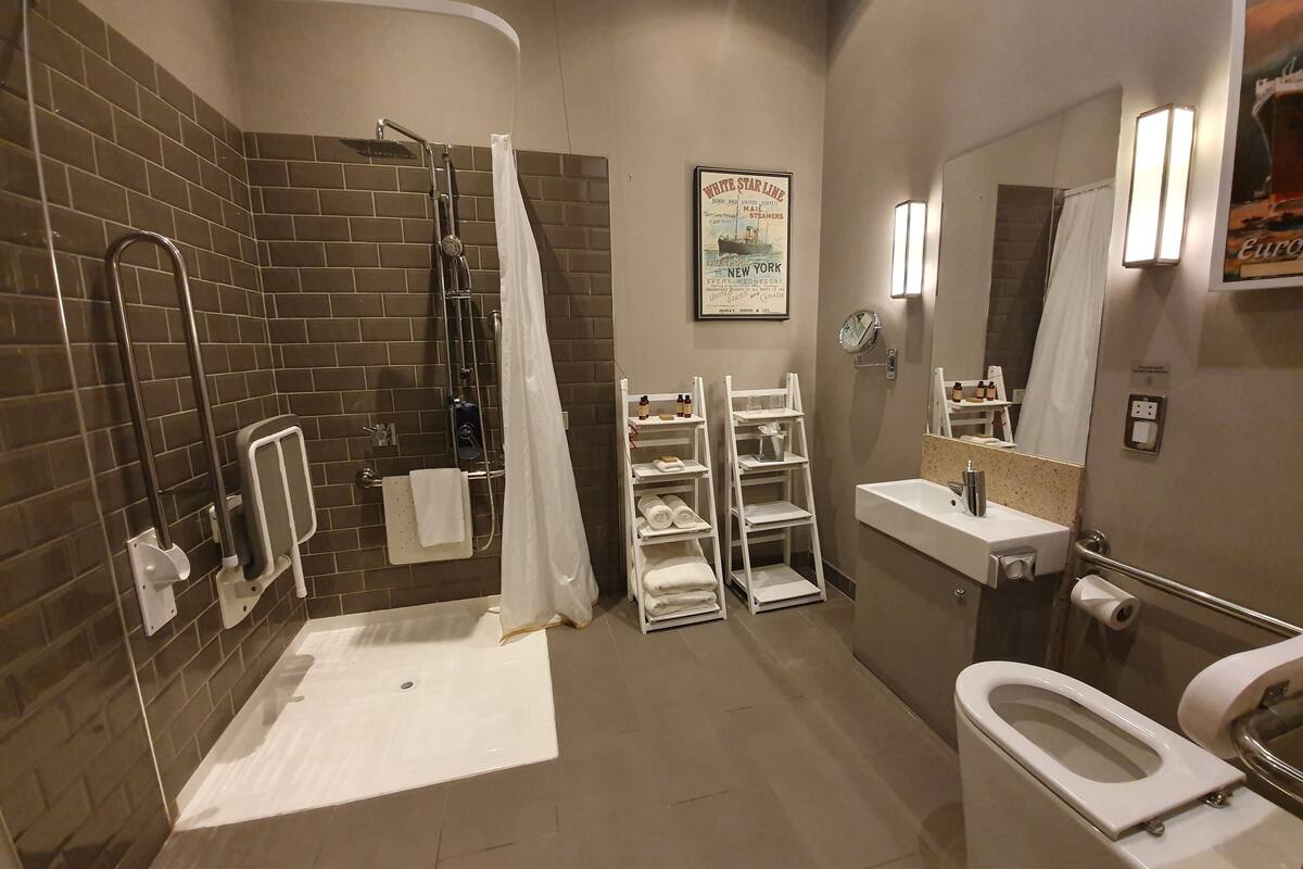 superior double room, accessible | bathroom | combined shower/bathtub, rainfall showerhead, designer toiletries
