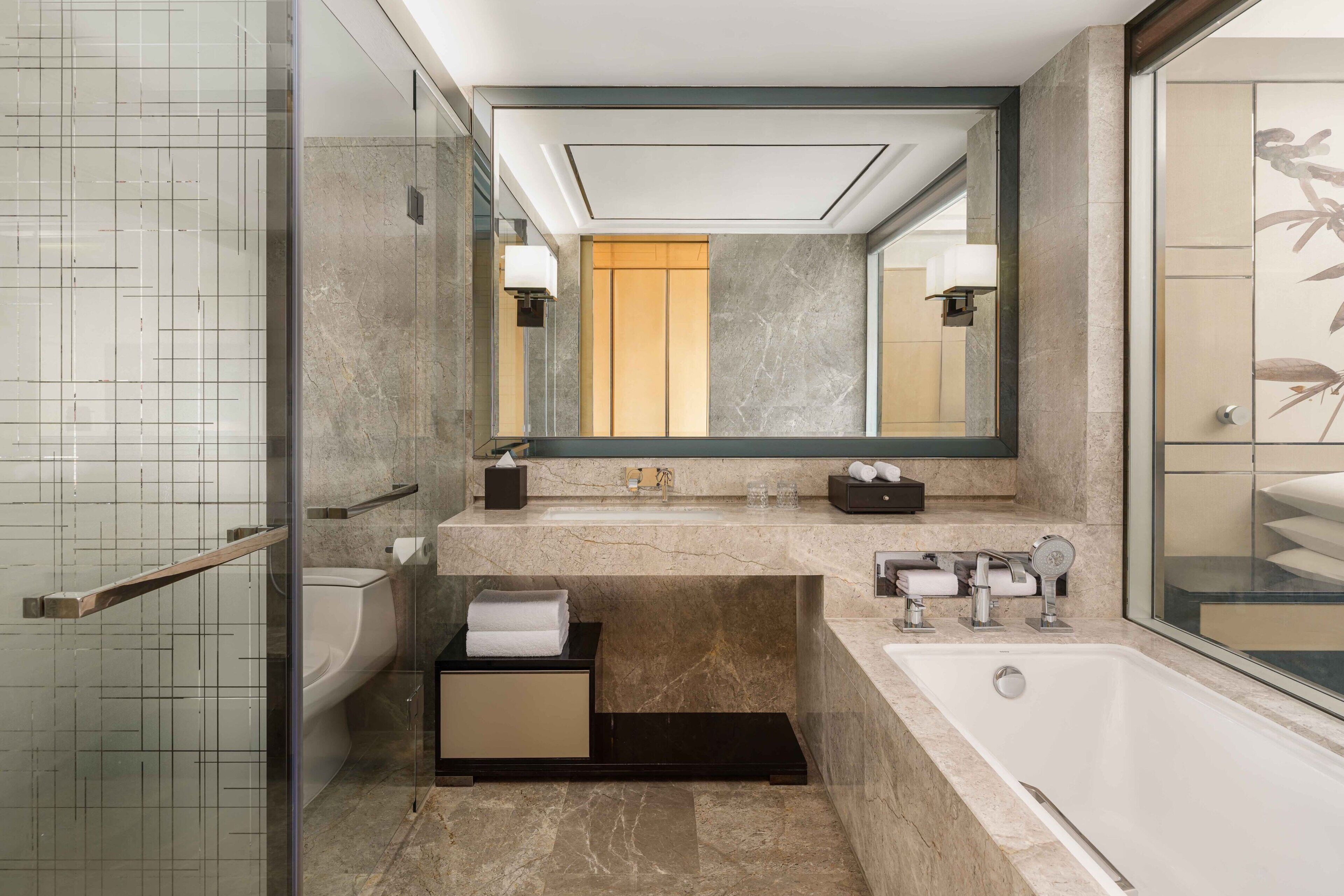 separate bathtub and shower, free toiletries, hair dryer, bathrobes