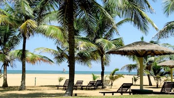 On the beach, sun loungers, beach umbrellas, water skiing