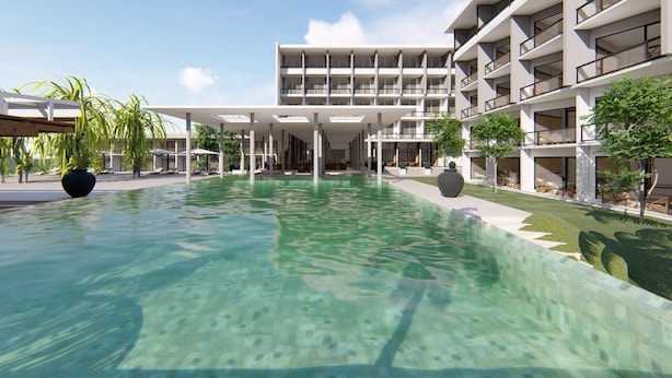 A modern hotel with a central swimming pool, outdoor seating, and a multi-story building with balconies. - Goldi Sands Hotel (Negombo)