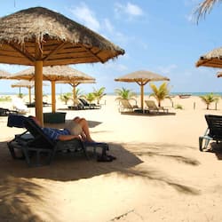On the beach, sun-loungers, beach umbrellas, waterskiing