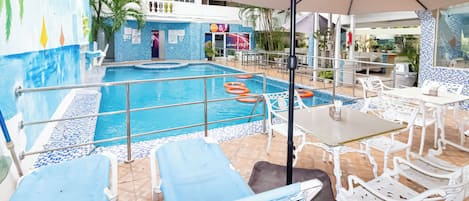Indoor pool, outdoor pool, open 7 AM to 7 PM, pool umbrellas
