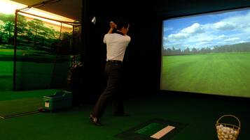 Practice your swing in a state-of-the-art golf simulation room.