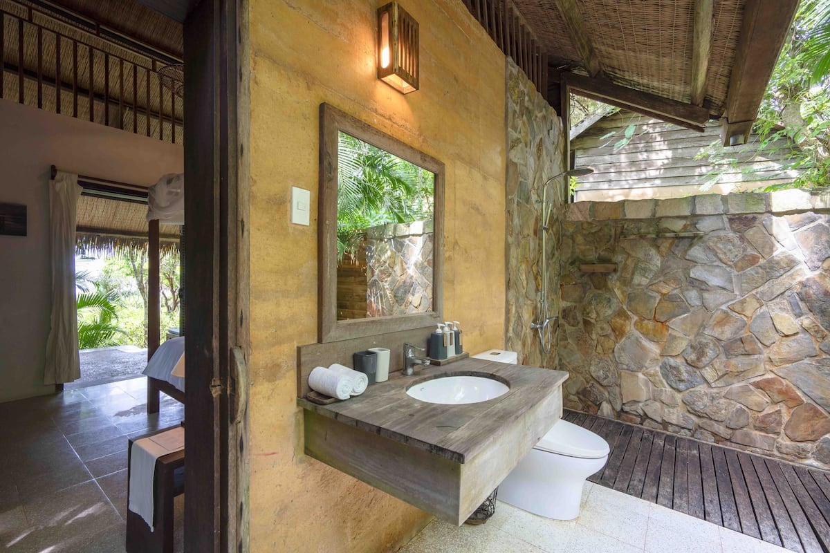 superior garden view rammed earth room | bathroom | shower, free toiletries, hair dryer, slippers