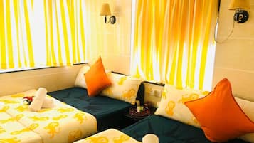 Suite, 2 Bedrooms | Living room | 32-inch LCD TV with cable channels, TV