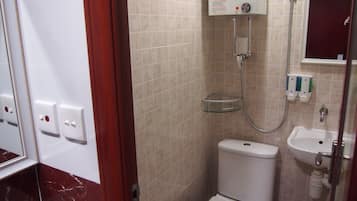 Shower, hair dryer, slippers, towels