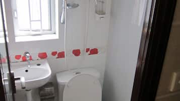 Shower, hair dryer, slippers, towels