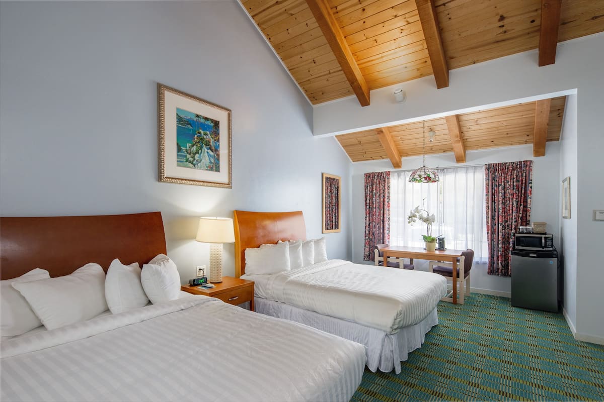 Standard, Two Queen Room | Desk, laptop workspace, blackout drapes, iron/ironing board