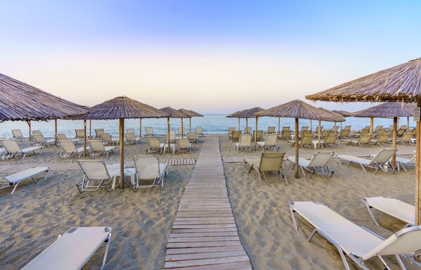 On the beach, sun loungers, beach umbrellas, beach bar
