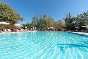 Indoor pool, seasonal outdoor pool, pool umbrellas, pool loungers