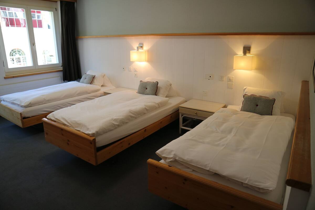 Triple Room | Hypo-allergenic bedding available, down comforters, in-room safe, desk