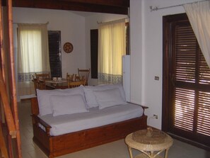 Apartment, 3 Bedrooms, Balcony, Garden View | Living area | TV - Residence Spiaggia Bianca (Golfo Aranci)