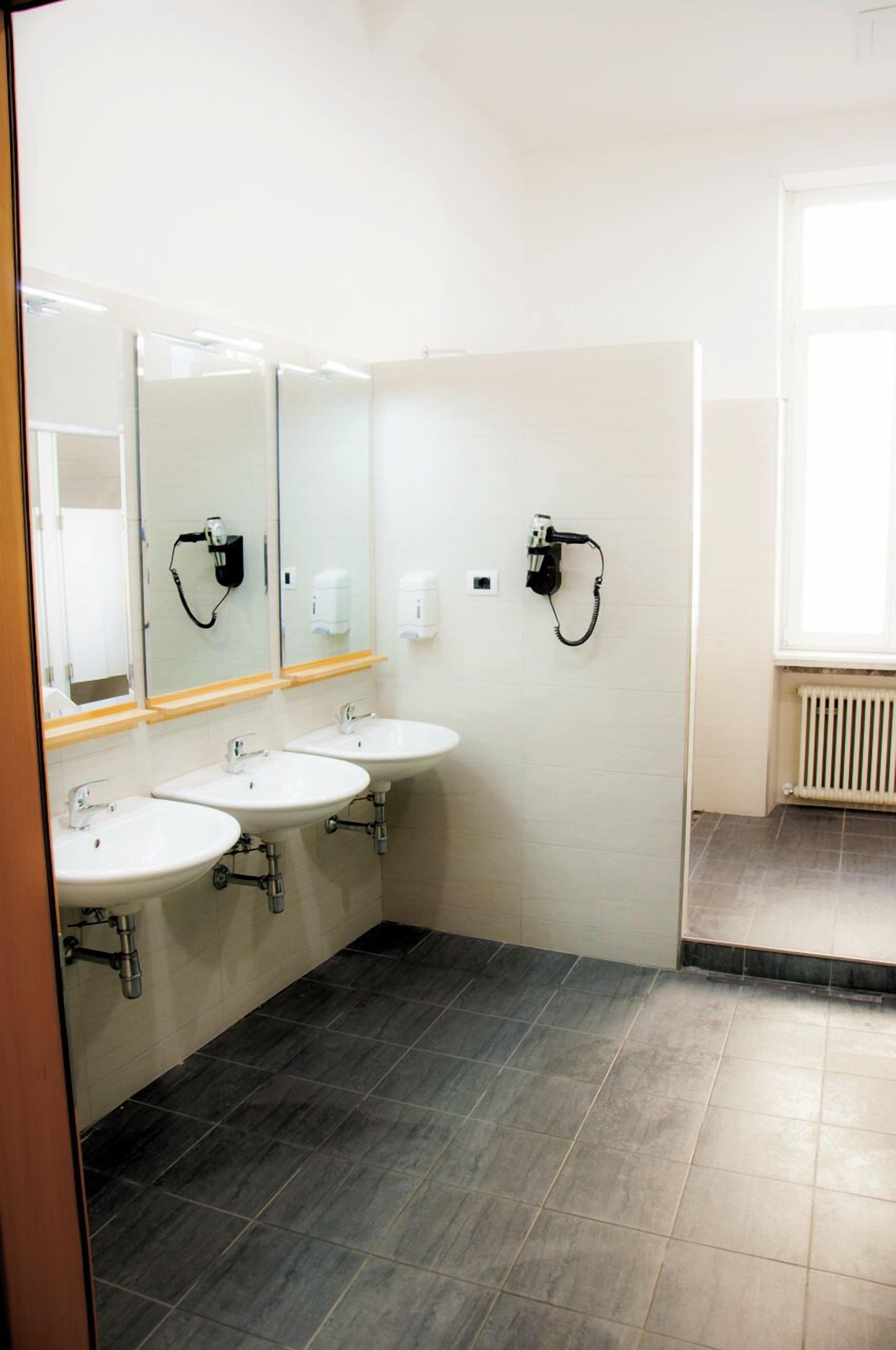 Shower, hair dryer, soap, toilet paper