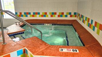 Enjoy a refreshing swim in our pool, surrounded by a safety barrier and colorful tiles.