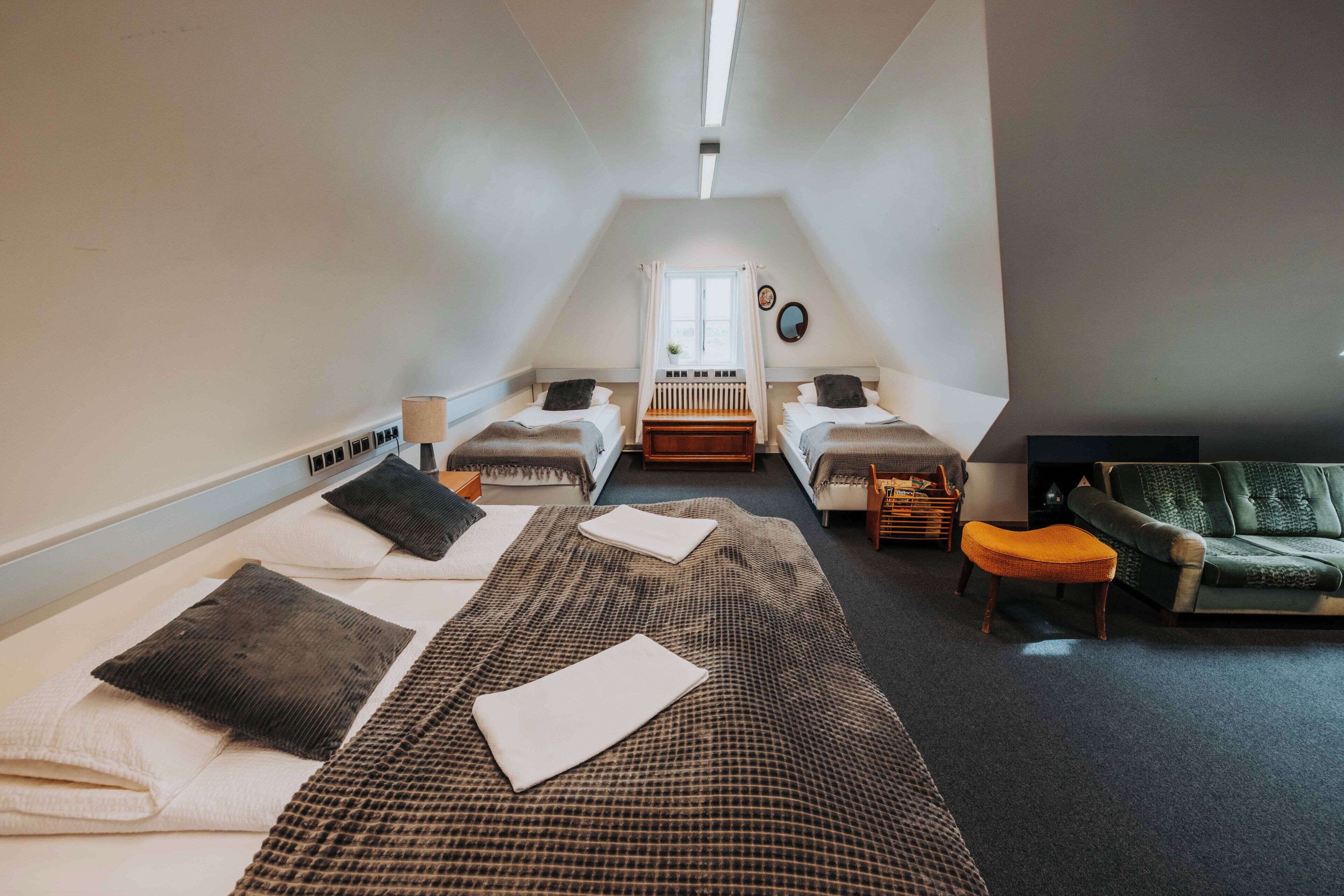 family room, shared bathroom | premium bedding, individually decorated, individually furnished