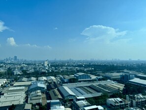 An aerial view of a cityscape with various buildings, including industrial and commercial structures.