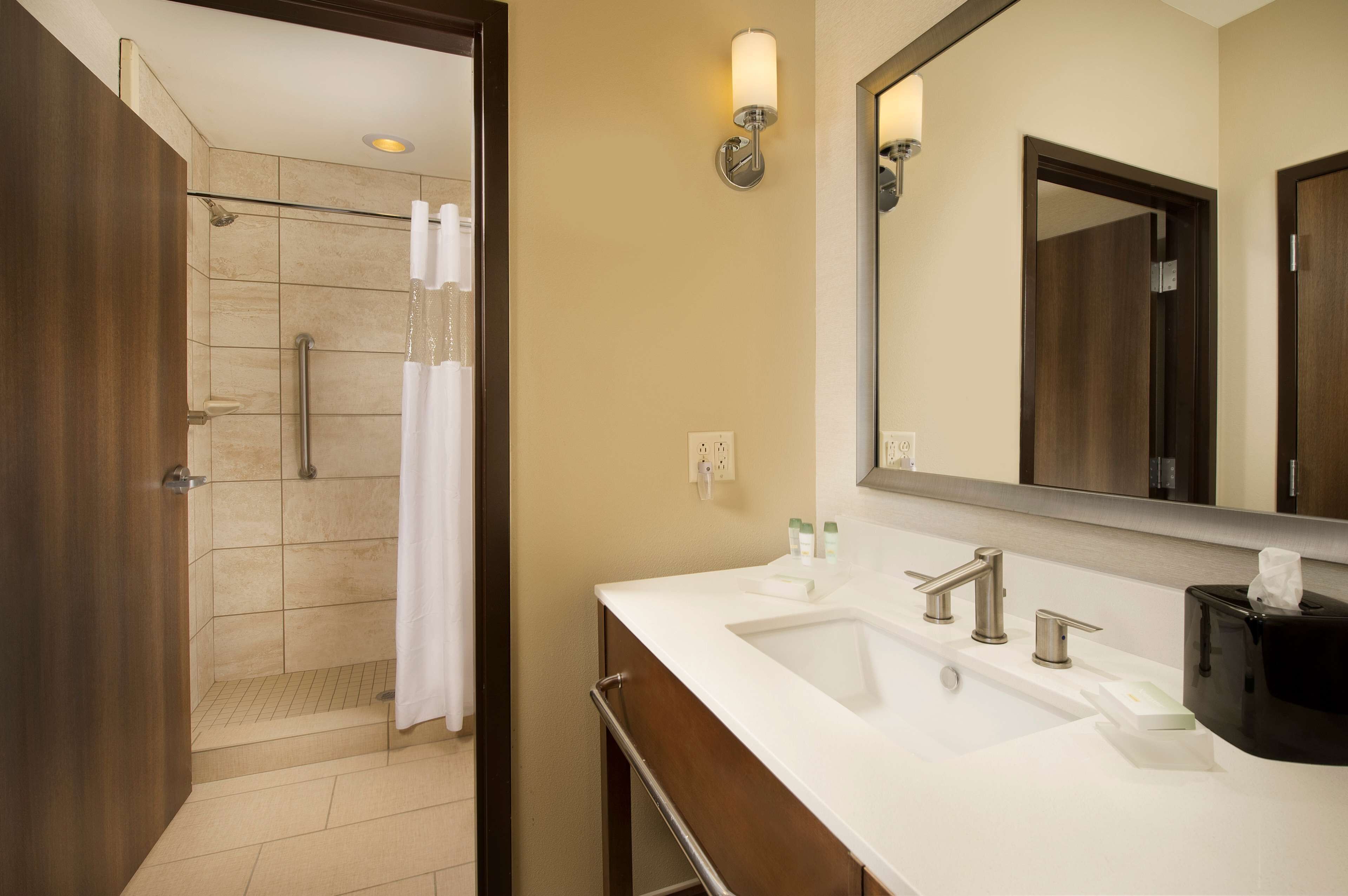 suite, 1 king bed, accessible (mobility & hearing, roll-in shower) | bathroom | combined shower/bathtub, designer toiletries, hair dryer, towels
