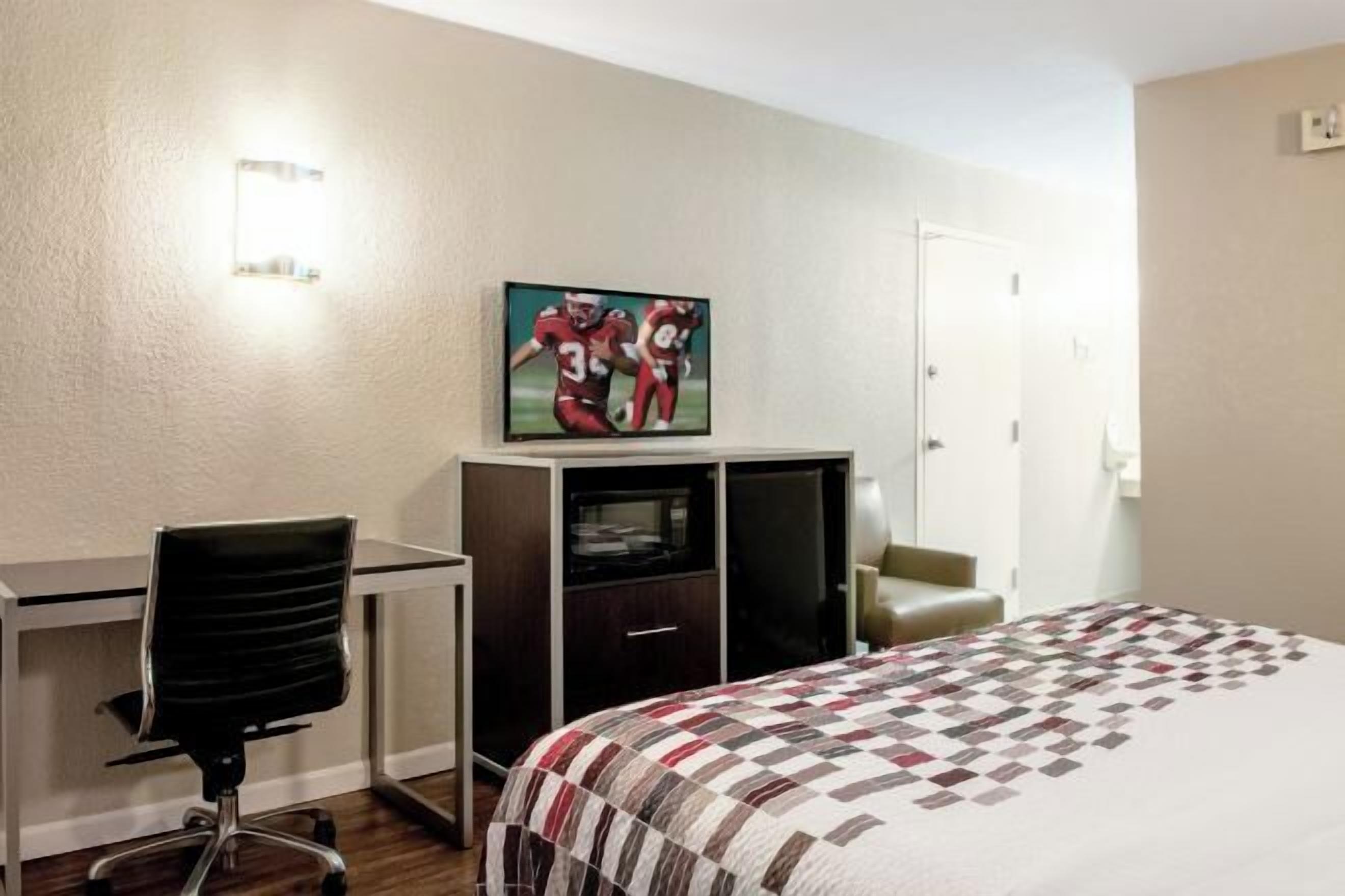 Desk, laptop workspace, blackout drapes, iron/ironing board