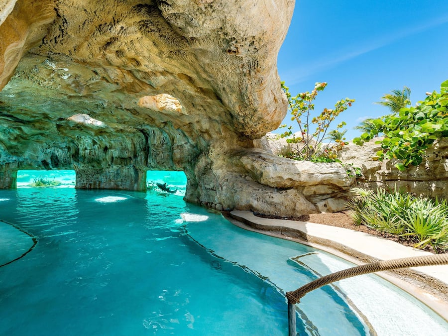 On the beach, white sand, beach cabanas, sun-loungers