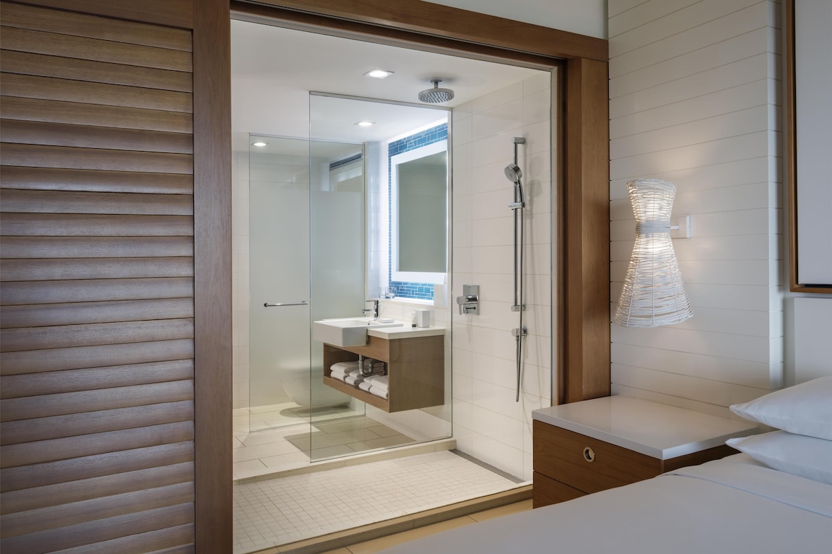 Designer toiletries, hair dryer, bathrobes, slippers