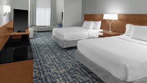 A hotel room with two beds, a flat-screen TV, a desk, and a lamp. - Fairfield Inn & Suites Calhoun (Calhoun)