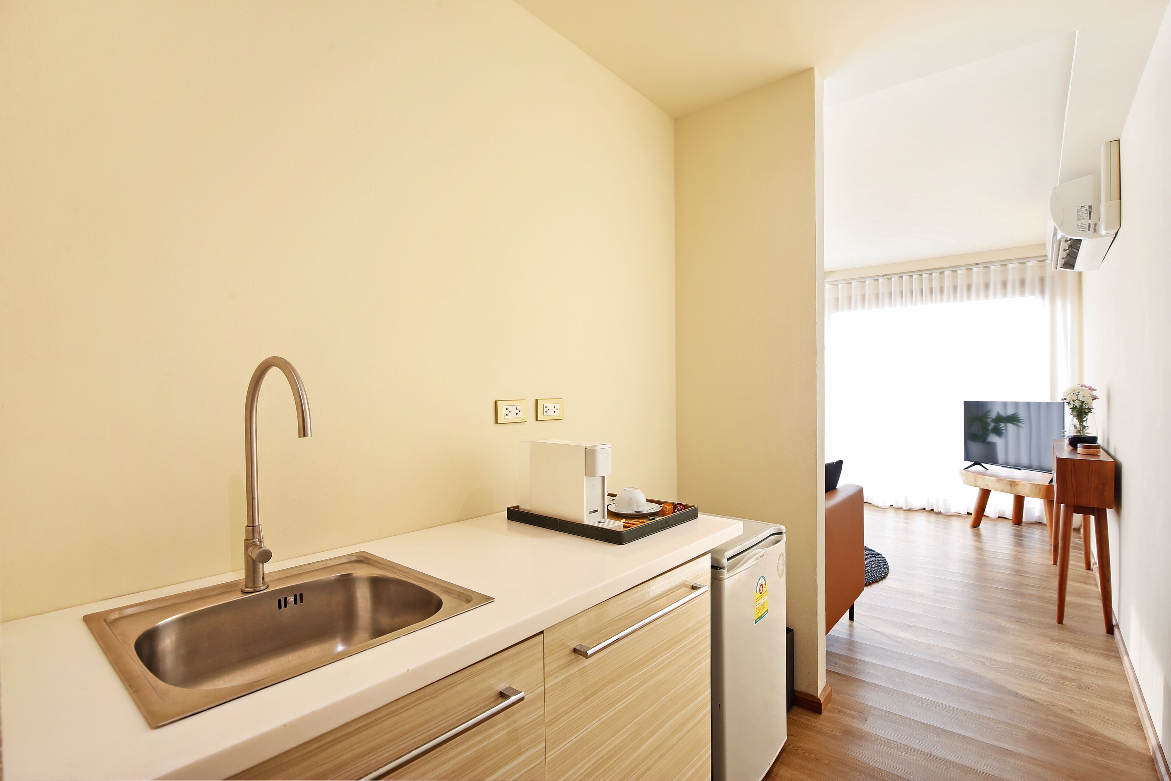 junior suite, 1 king bed, sea view | private kitchen | fridge, espresso maker
