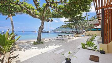 On the beach, sun-loungers, beach towels, scuba diving