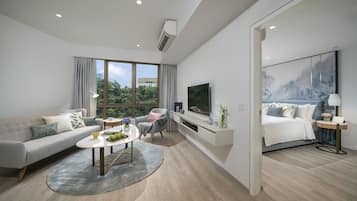 Premier Suite, 1 Bedroom | Living area | 43-inch LCD TV with cable channels