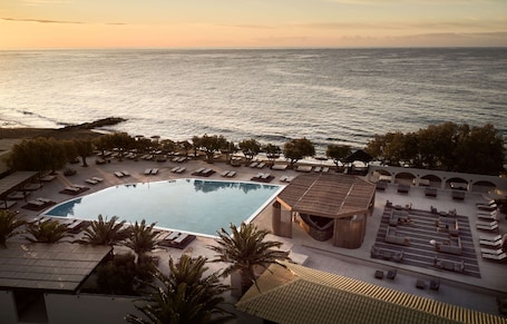 2 outdoor pools, open 10:00 AM to 6:30 PM, pool umbrellas, pool loungers. Numo Ierapetra Beach Resort Crete, Curio Collection Hilton