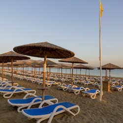 On the beach, sun-loungers, beach umbrellas, beach volleyball