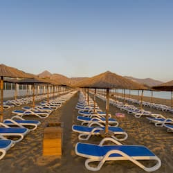 On the beach, sun-loungers, beach umbrellas, beach volleyball