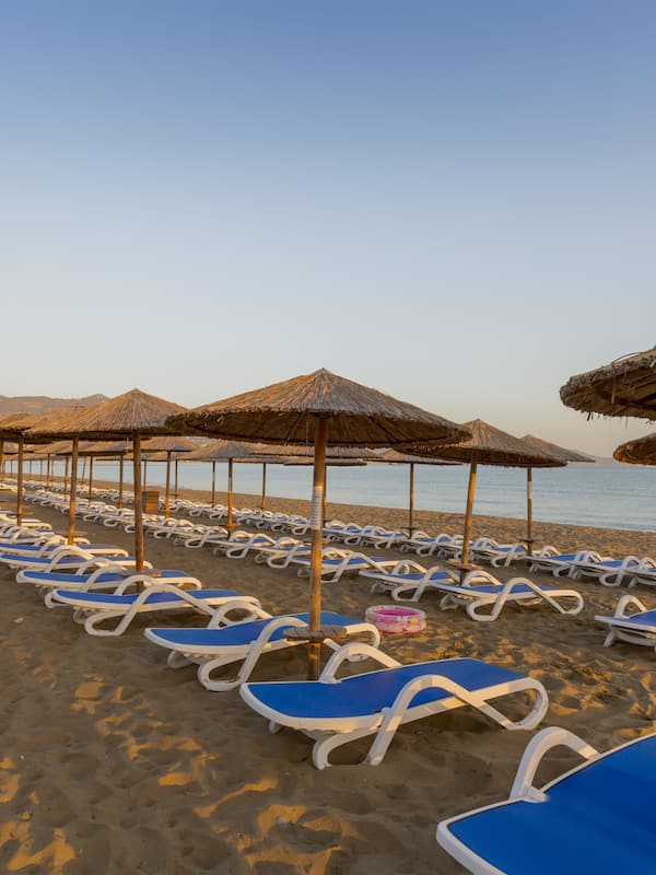 On the beach, sun-loungers, beach umbrellas, beach volleyball