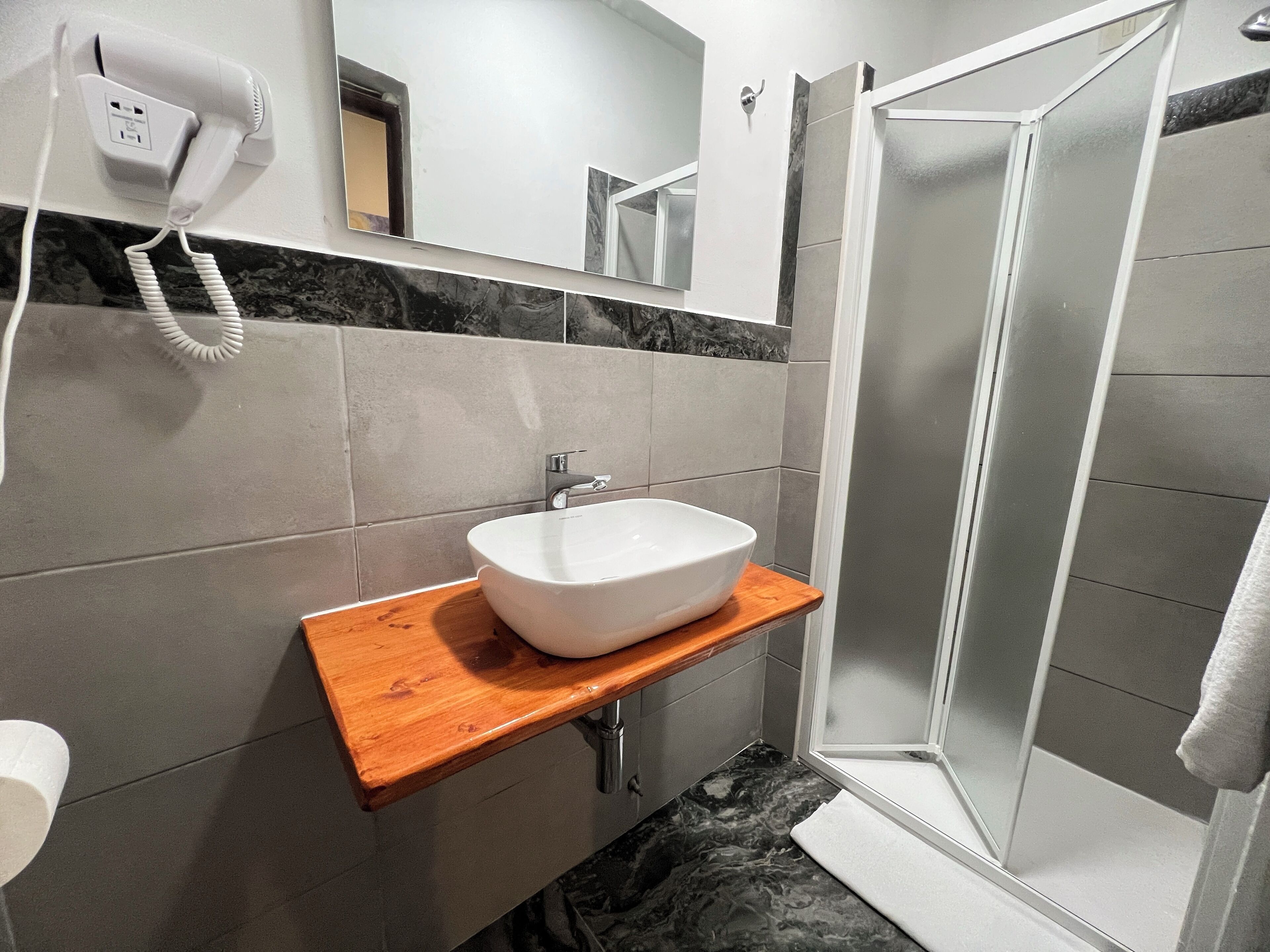 Basic Double Room, 1 Double Bed | Bathroom | Rainfall showerhead, hair dryer, towels