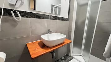 Basic Double Room, 1 Double Bed | Bathroom | Rainfall showerhead, hair dryer, towels