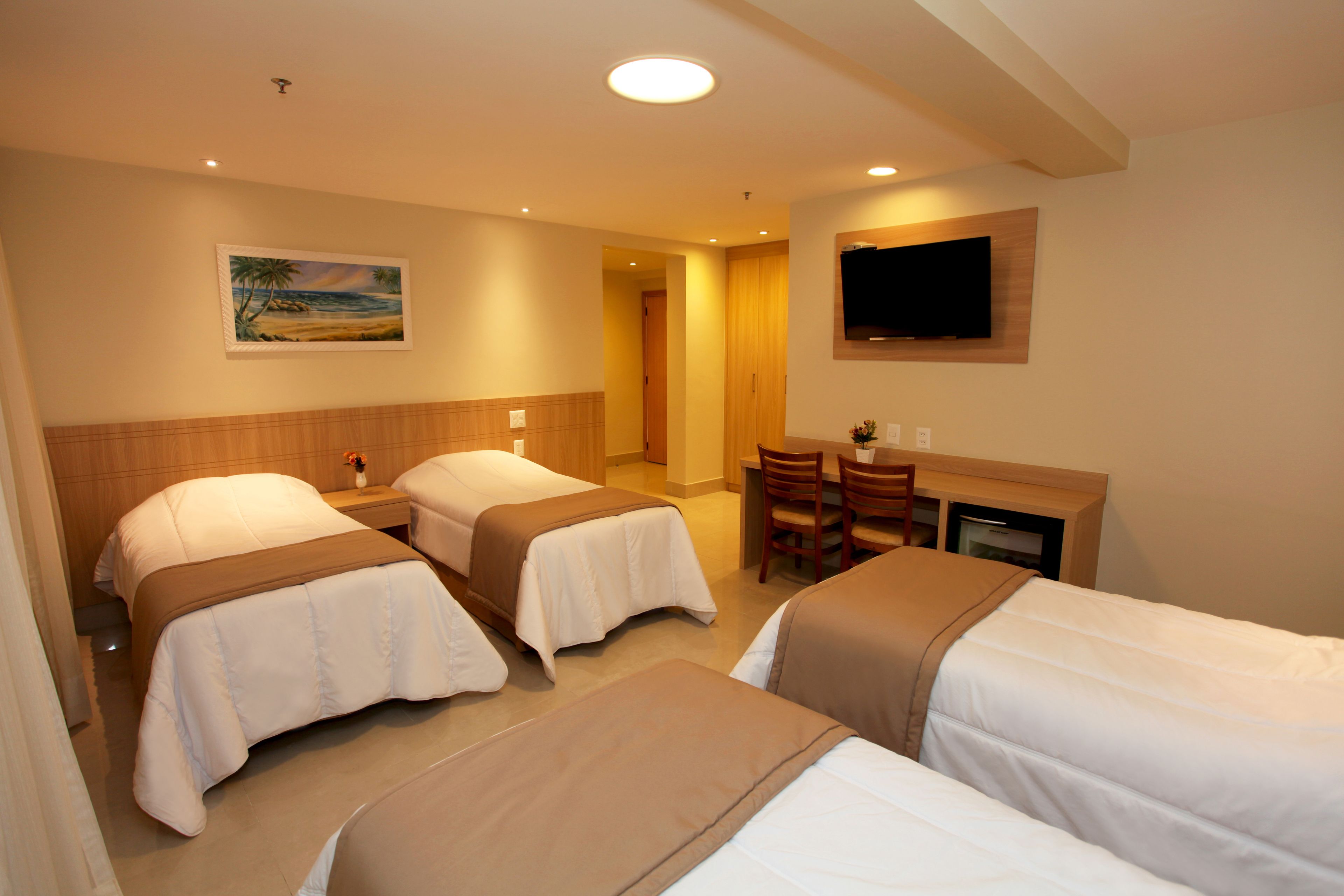 family quadruple room | minibar, in-room safe, desk, laptop workspace