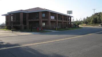 A two-story building with a sign indicating it is a motel.