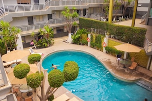 Outdoor pool, open 9:00 AM to 9:00 PM, pool umbrellas, sun loungers