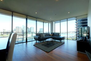 Executive Three Bedroom Two Bathroom Apartment | Living area | 51-inch LCD TV with cable channels, TV, DVD player - ACD Apartments (Docklands)