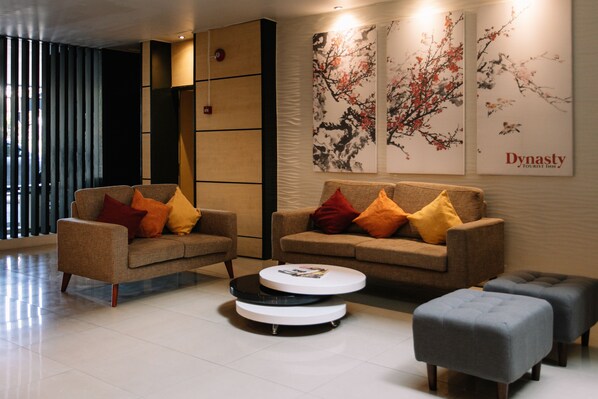 Relax in style with plush sofas and comfortable seating areas, surrounded by vibrant artwork and natural light.