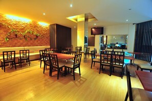 Enjoy a warm and inviting dining experience with a variety of seating options and a rustic-chic atmosphere.