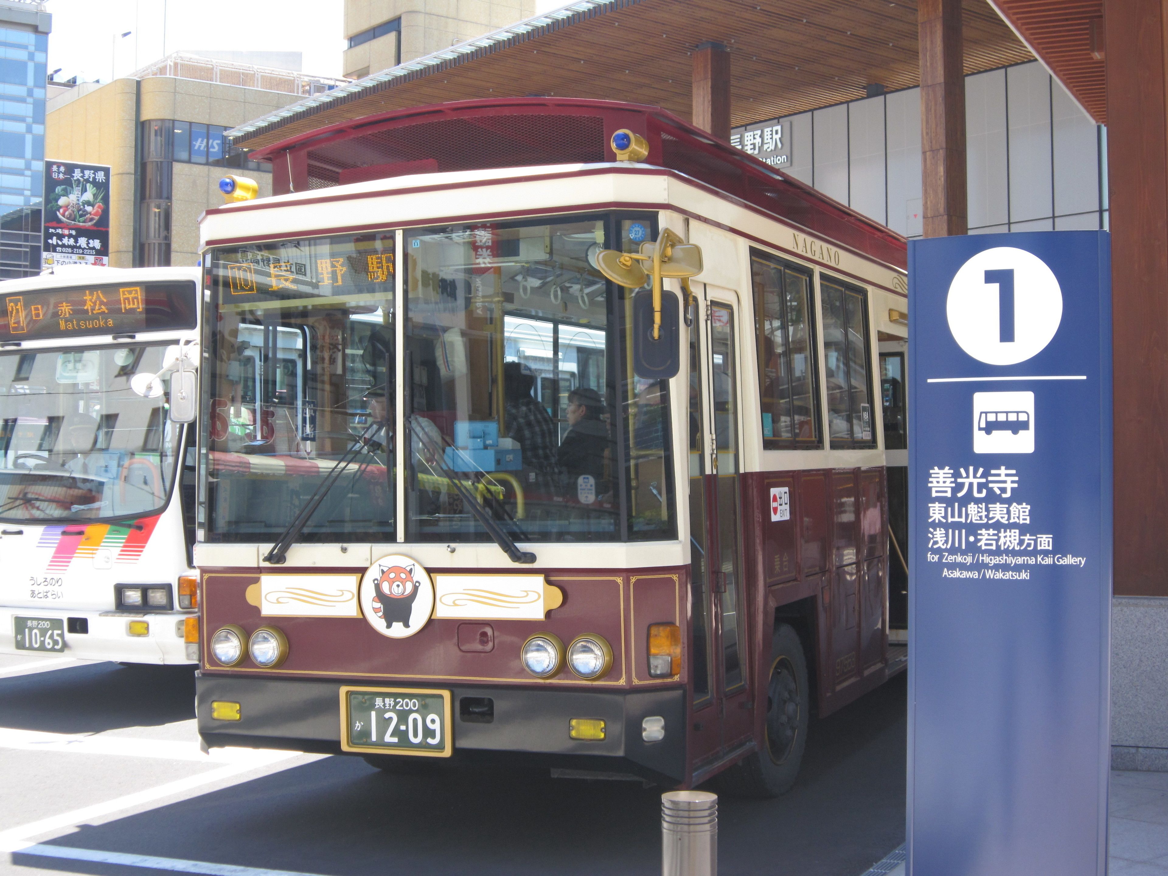 A bus with a destination sign for Nagano.