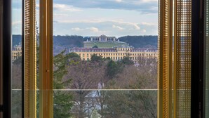 A view through a window with a building in the background. - Doubletree by Hilton Vienna Schonbrunn (Vienna)