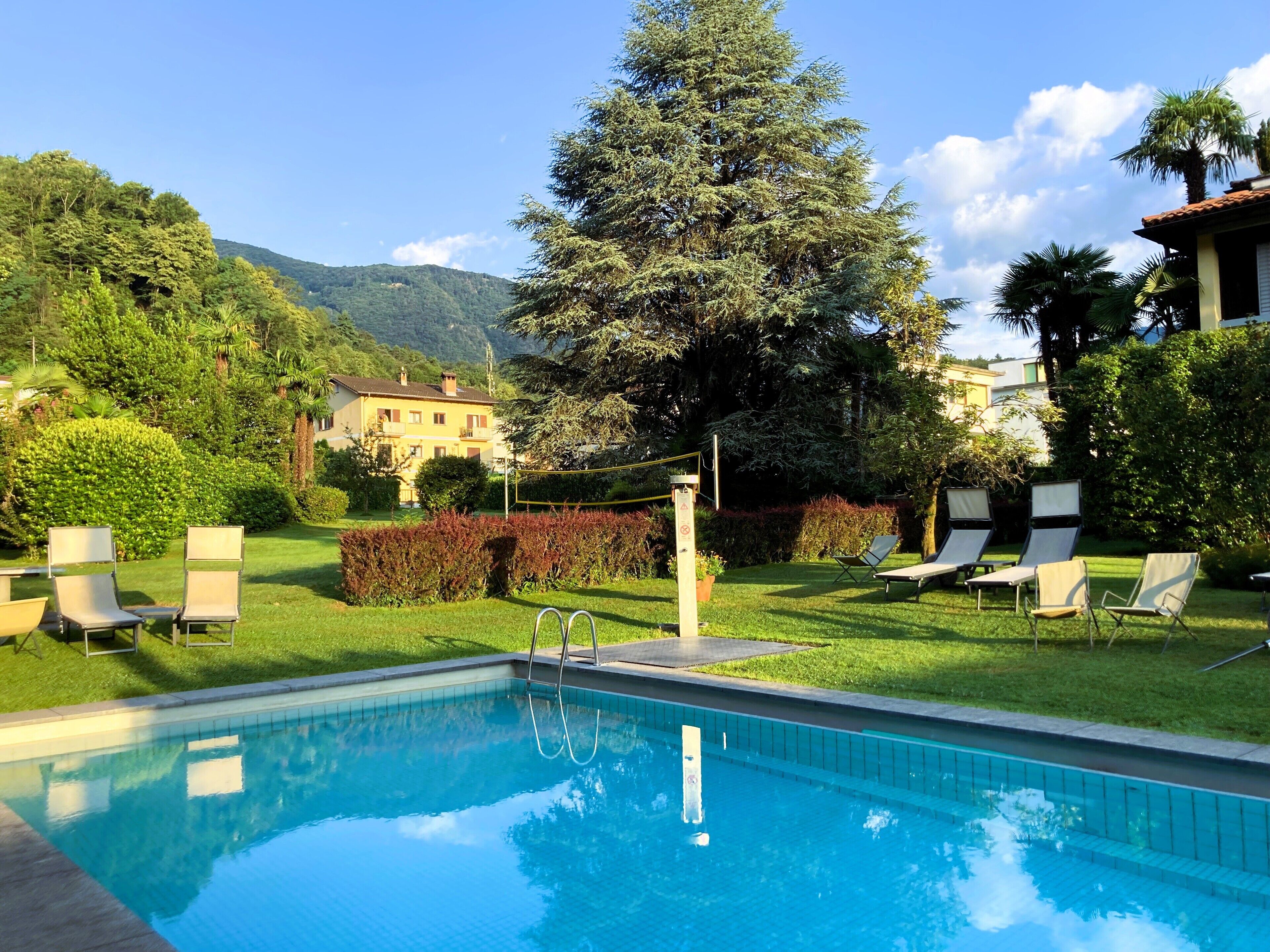 Outdoor pool, open 7:00 AM to 7:30 PM, pool umbrellas, sun loungers