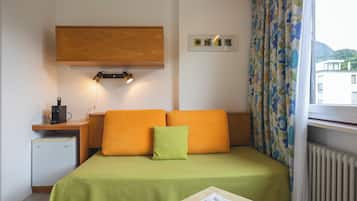 Economy Double Room, 1 Bedroom | Living area | Flat-screen TV, toys
