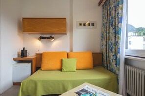 Economy Double Room, 1 Bedroom | Living area | Flat-screen TV, toys - Villa Siesta, Park & Pool Living (Losone)