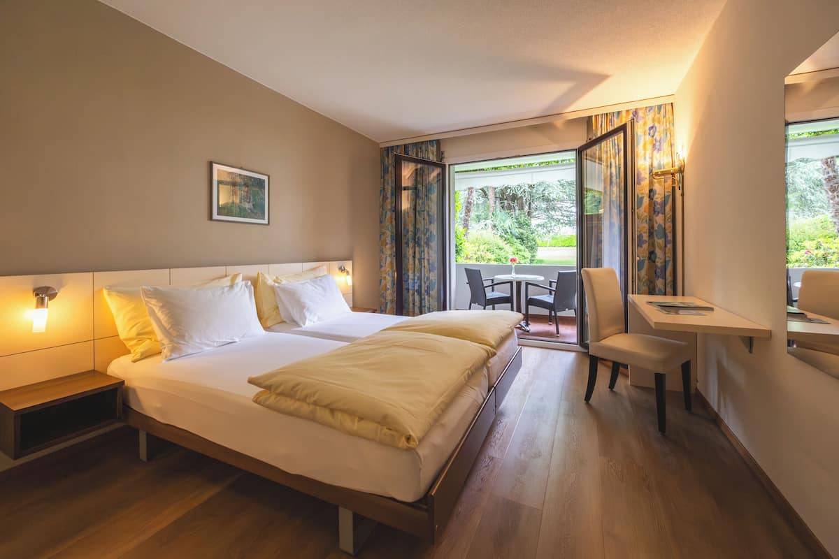 Family Apartment, 2 Bedrooms, Balcony, Garden View | Premium bedding, in-room safe, desk, blackout drapes
