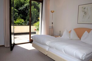 家庭顶层房, 4 间卧室, 露台, 花园景观 | 高档床上用品、客房内保险箱、办公桌、遮光窗帘