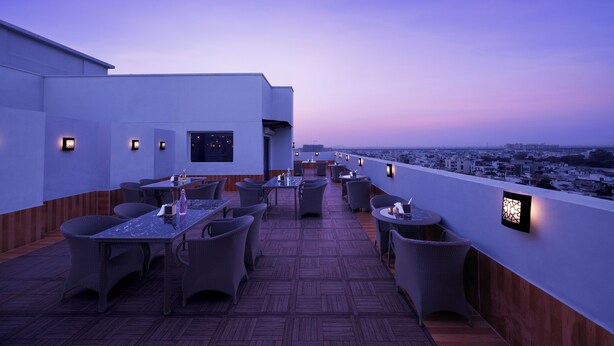 A rooftop terrace with outdoor seating and city views. - Ginger Jaipur (Jaipur)