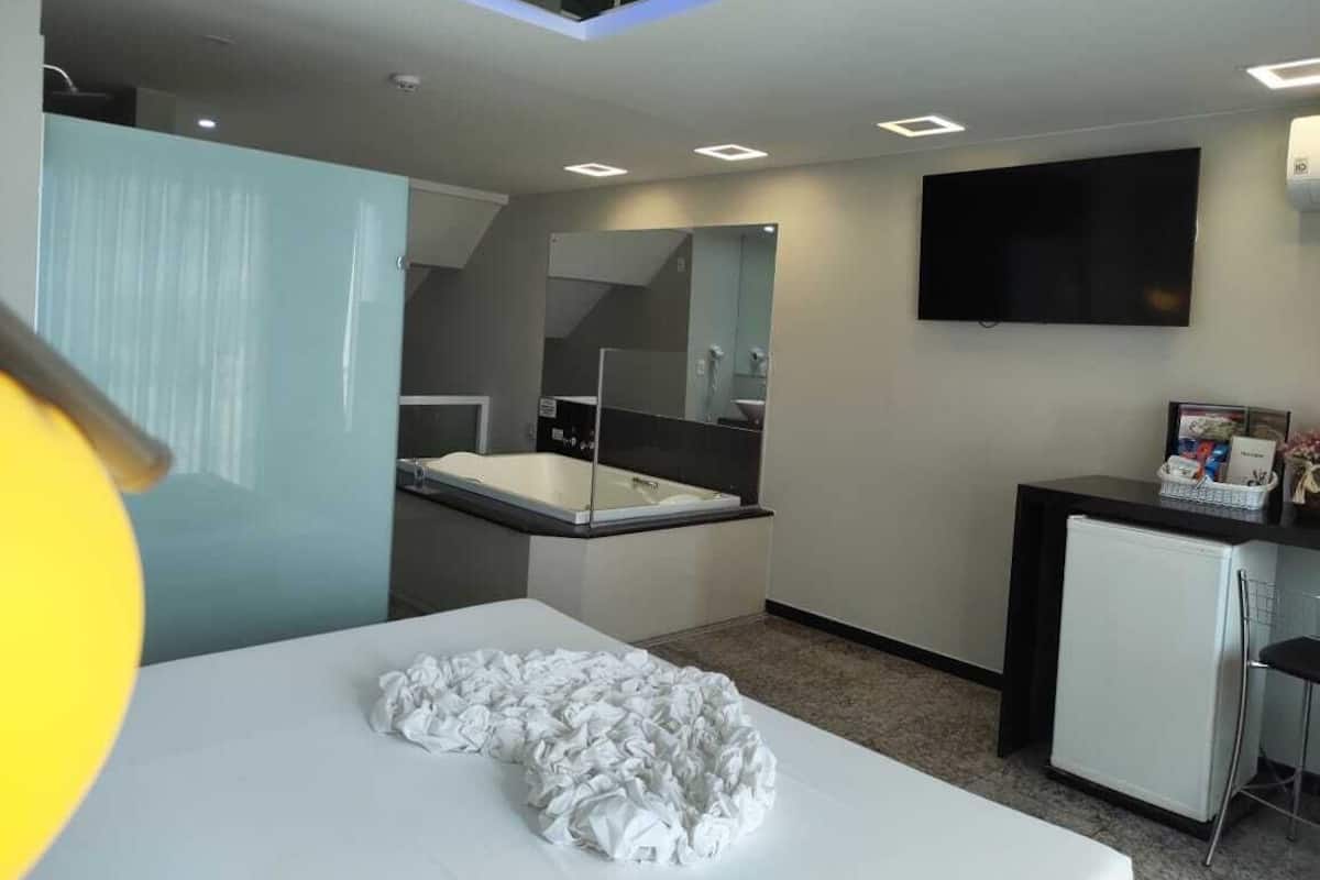 Deluxe kamer | Badkamer | Een douche, gratis toiletartikelen, een haardroger, handdoeken