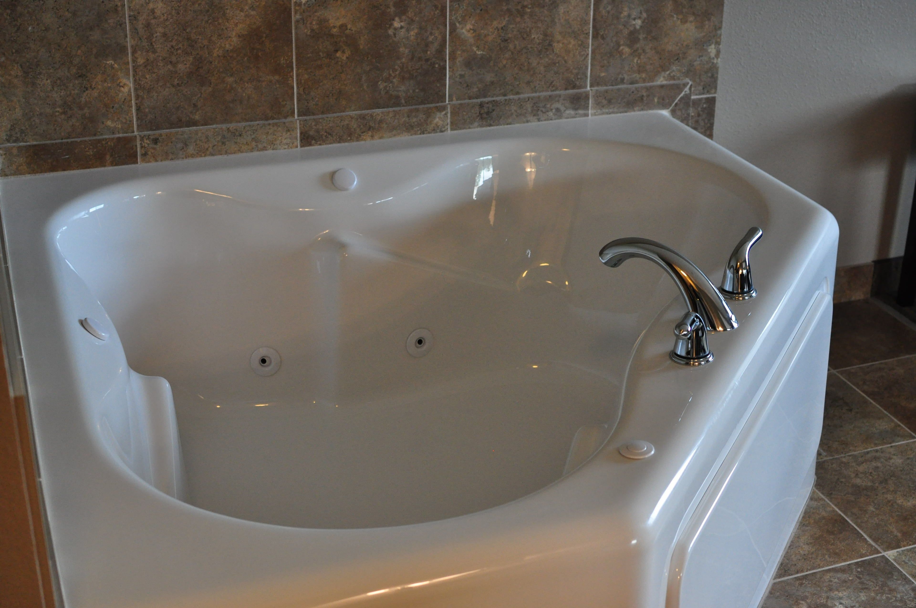 suite, 1 king bed with sofa bed, jetted tub | jetted bathtub